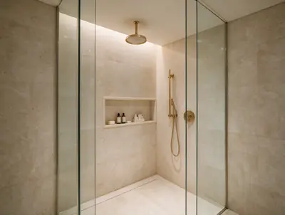 Glass-walled shower area with a rain shower head